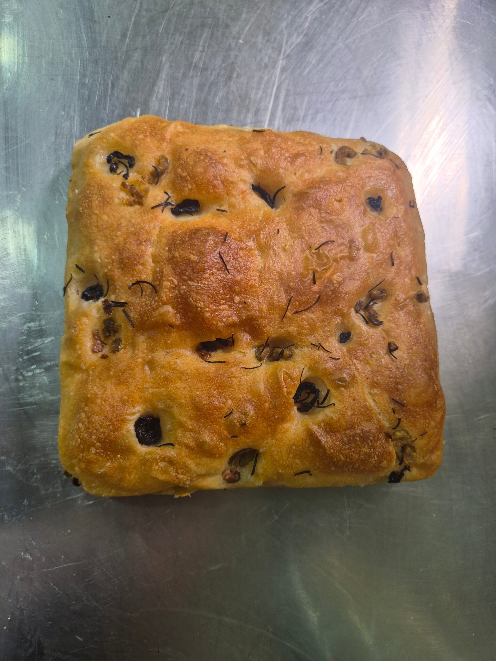 Sourdough focaccia bread with herbs and olive oil